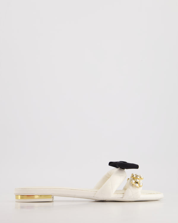 Chanel White Flat Sandals with Crystal CC Logo, Pearl Clover Embellishment, and Black Bow Detail Size EU 39