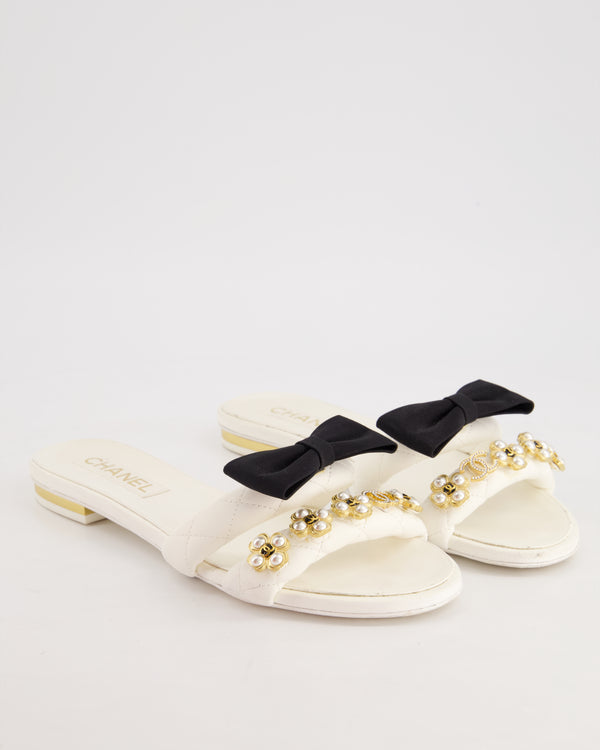 Chanel White Flat Sandals with Crystal CC Logo, Pearl Clover Embellishment, and Black Bow Detail Size EU 39